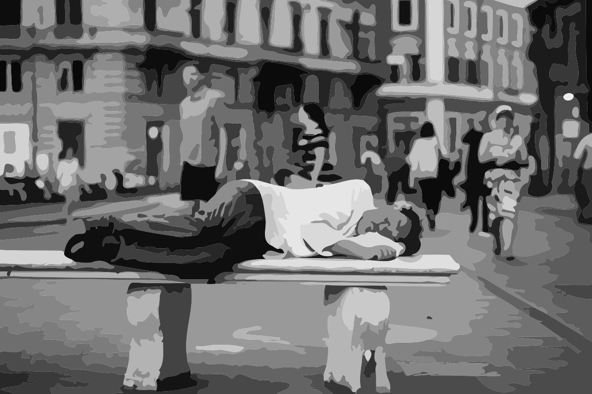 a man sleeping on a bench on the street. Depicting how hard it is to control what happens in life.
